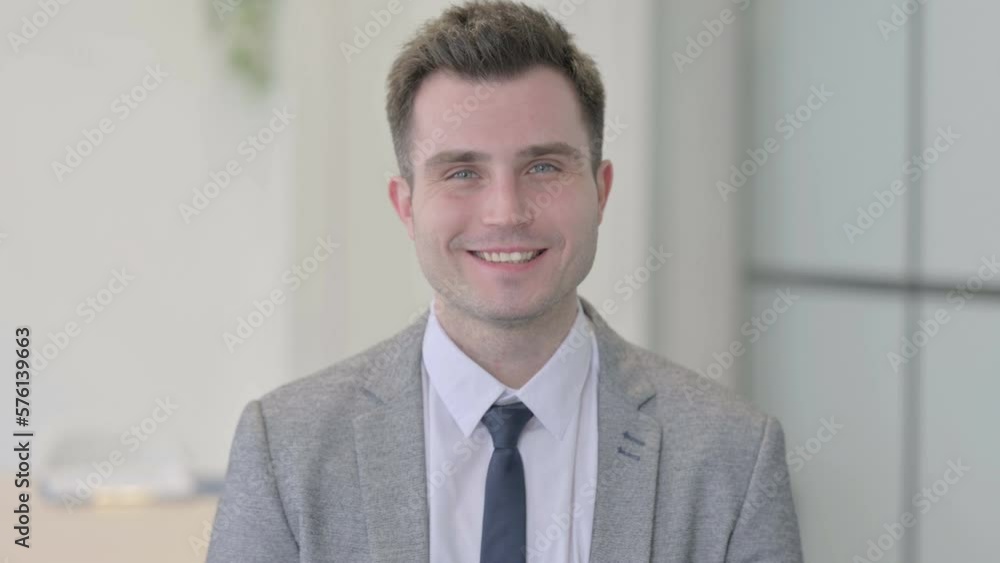 Portrait of Young Businessman Smiling at Camera Portrait of Young Businessman Smiling at Camera