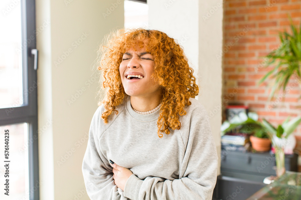 Fototapeta premium young red hair latin pretty womann at new cool home