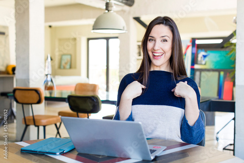 young pretty woman feeling happy and pointing to self with an excited. telecommuting concept Free Download young pretty woman feeling happy and pointing to self with an excited. telecommuting concept - GFXLoad