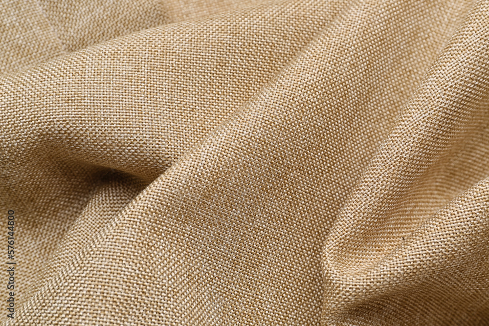 Fototapeta premium Closeup view of crumpled beige fabric as background
