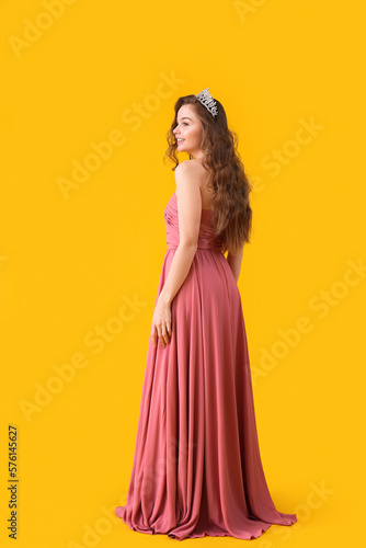 Elegant young woman in pink...