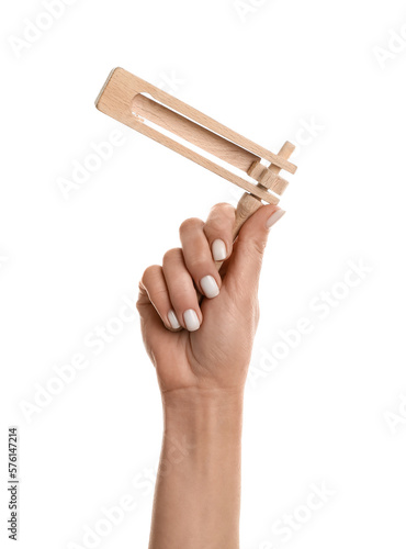 Woman with Jewish rattle for Purim holiday on white background photo