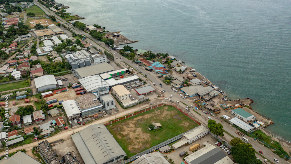 Factories and industrial facilities near the shores of the harbour.