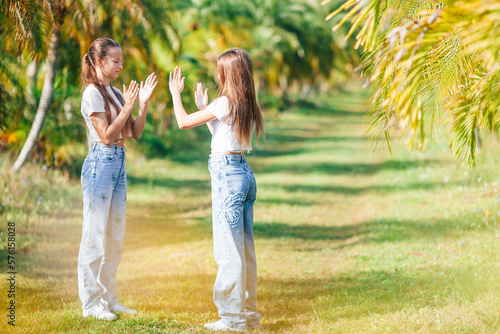 Beautiful teen girls having fun together on summer tropical vacation 