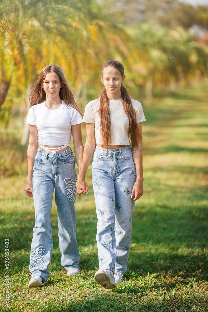 Beautiful teen girls having fun together on summer tropical vacation Beautiful teen girls having fun together on summer tropical vacation