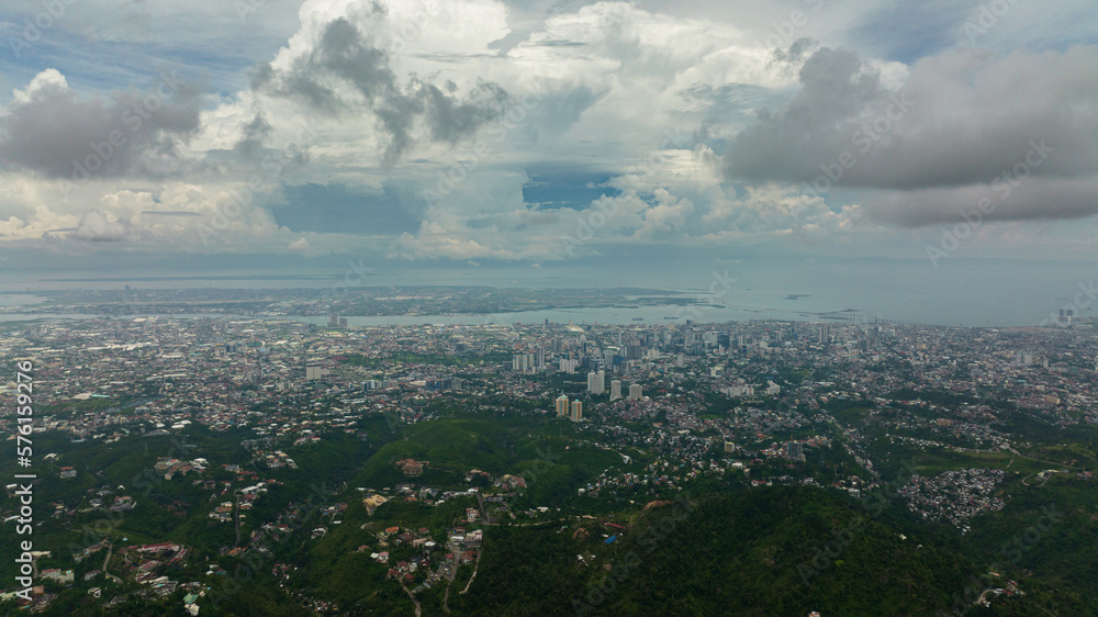 Top view of city of Cebu in the Philippines with residential buildings and skyscrapers.