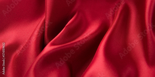 Smooth elegant red silk or satin luxury cloth texture background.