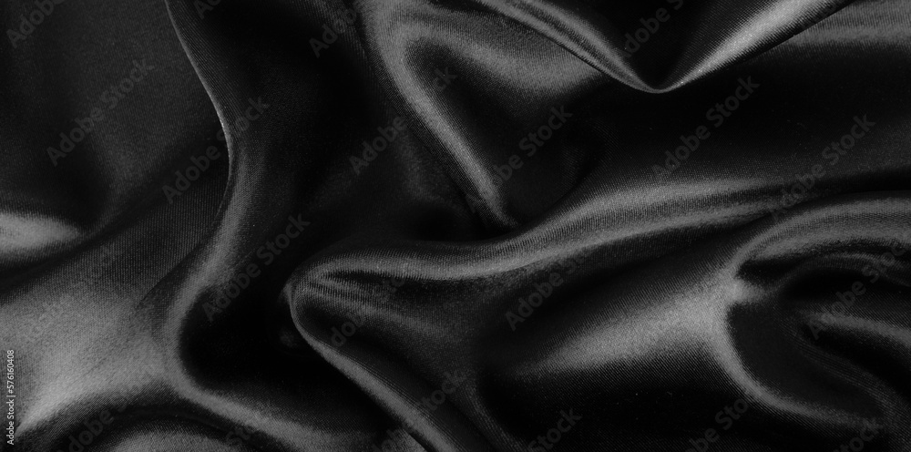 Smooth elegant black silk or satin luxury cloth texture background. Smooth elegant black silk or satin luxury cloth texture background.