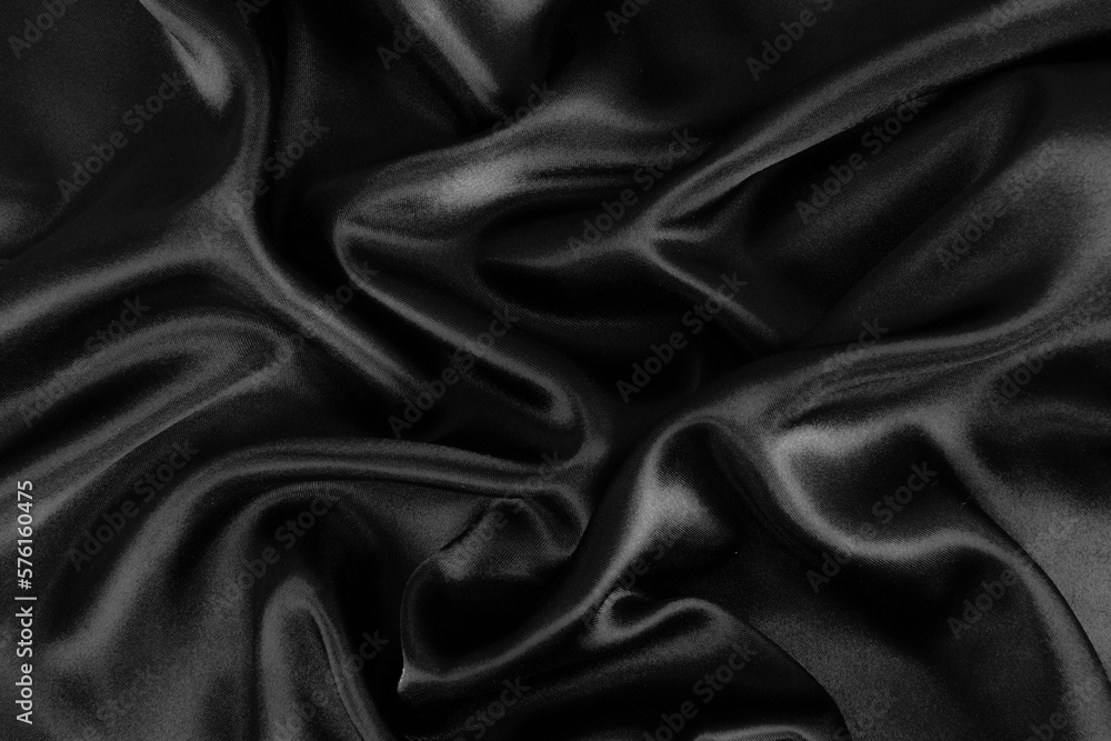 Smooth elegant black silk or satin luxury cloth texture background. Smooth elegant black silk or satin luxury cloth texture background.