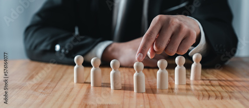 Young Asian businessman posing and pointing out plans in terms of profit distribution structure. Modern business expansion in real estate marketing.