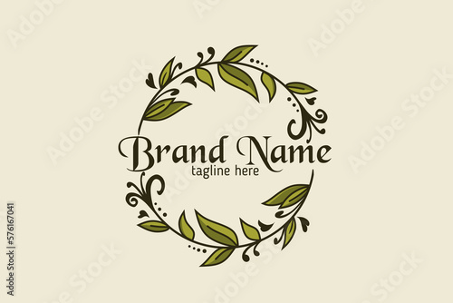 Leaf motif logo encircling the brand name