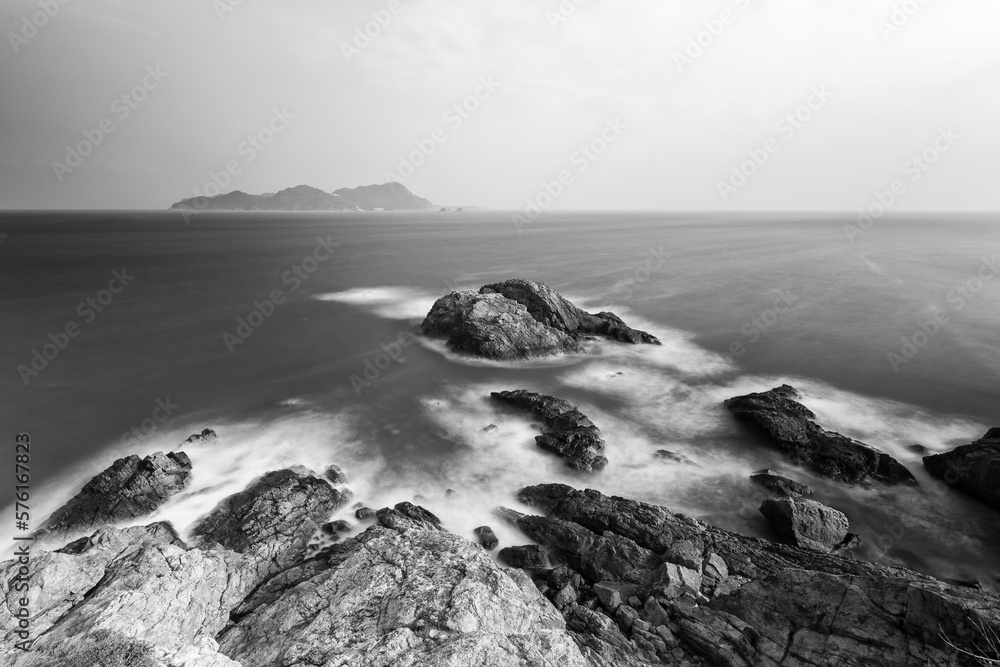 waves crashing on rocks, long exposure, black and white