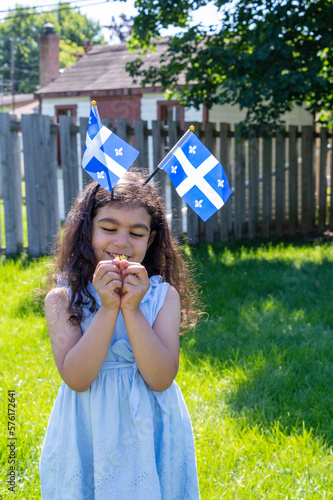 Girl celebrates the national holiday,
Drapeau québec - Happy Quebec Day
Quebec's National Holiday,
La Fete Nationale du Quebec,
St. Jean-Baptiste