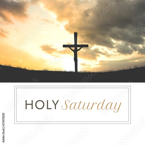 Composite of silhouette crucifix on land against cloudy sky at sunset and holy saturday text