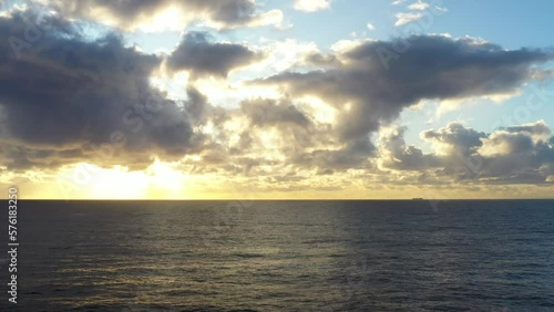 Aerial drone shot flying towards a beautfiul sunrise over the ocean near Bondi Austraia photo