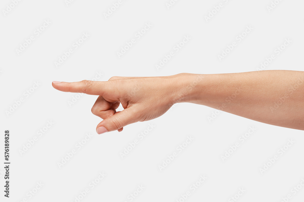 Woman's hand pointing to the left with the index finger.
Woman's hand pointing to the left with the index finger.