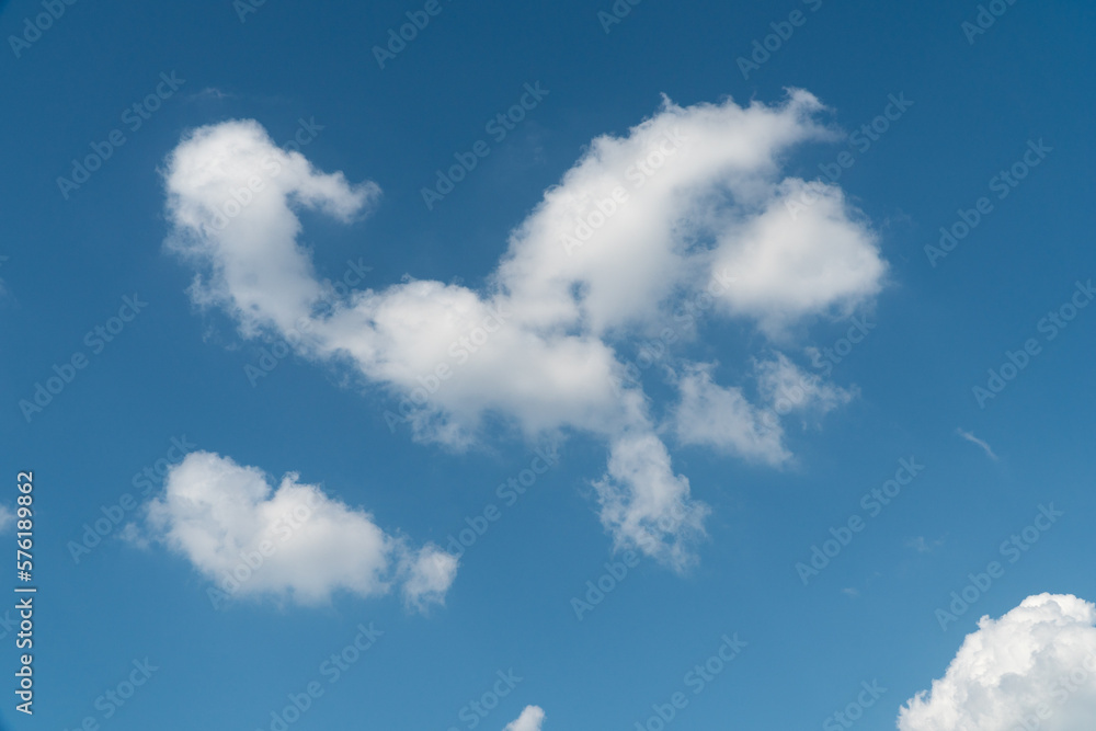 blue sky with a few white patchy clouds blue sky with a few white patchy clouds