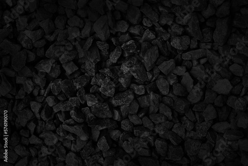 Black gray pebbles texture background, small stone gravel for garden decoration.