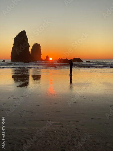 Scenic Sunset at Cannon Beach  Oregon with Haystack Rock and Pacific Ocean in View  Tourist Attraction and Relaxation in the Pacific Northwest
