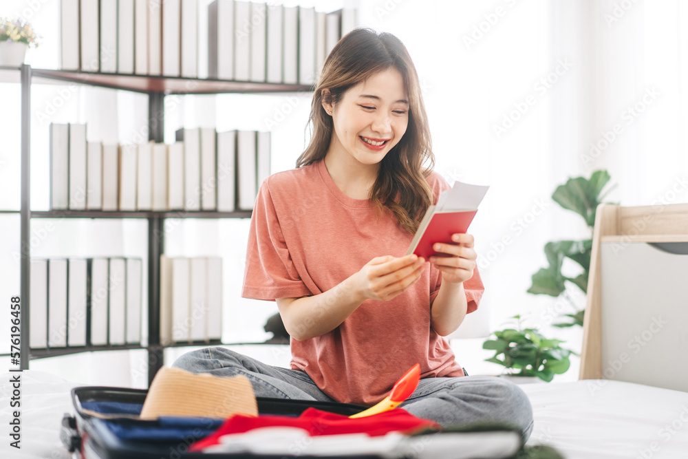 Young adult southeast asian woman showing passport ready for travel trip Young adult southeast asian woman showing passport ready for travel trip