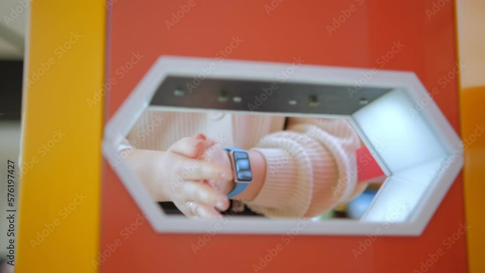 Close up washing hands with an automatic alcohol sanitizer dispenser at ...