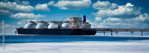 Oil and gas industry .Tanker for transportation of liquefied natural gas during loading at the LNG marine terminal.	