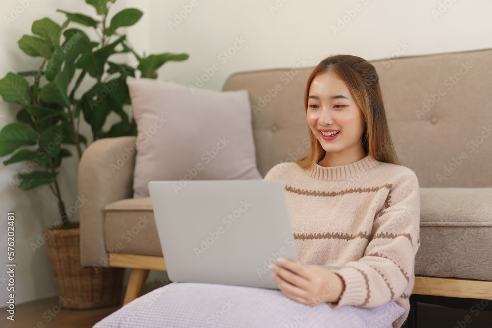 Leisure time concept, Women sitting on the floor to working and surfing social media on laptop Leisure time concept, Women sitting on the floor to working and surfing social media on laptop