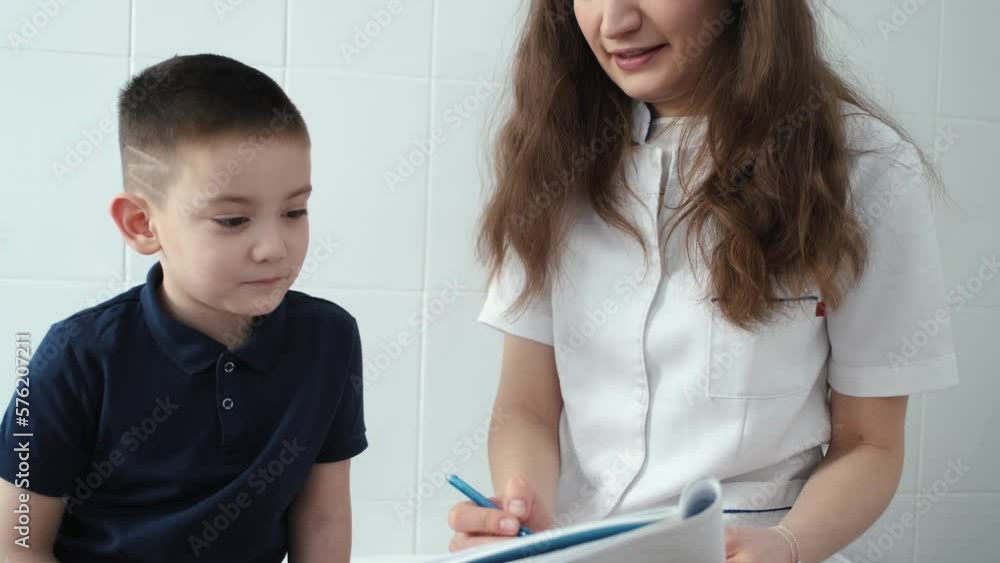 the doctor asks the child what is drawn in the notebook the doctor asks the child what is drawn in the notebook