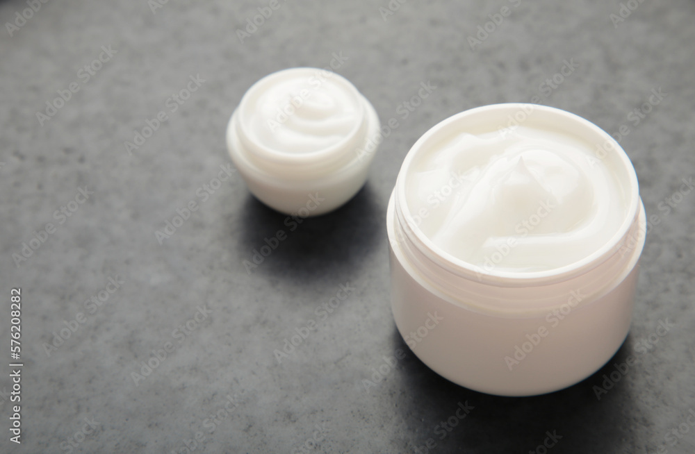 Face cream moisturizer in a jar on dark background. Luxury skincare cosmetics and anti-aging product for healthy skin and beauty routine Face cream moisturizer in a jar on dark background. Luxury skincare cosmetics and anti-aging product for healthy skin and beauty routine
