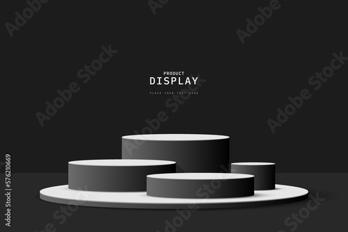 Abstract black 3D room with set of realistic black white cylinder pedestal podium. Minimal scene for product display presentation. Geometric forms design. Round stage for showcase.