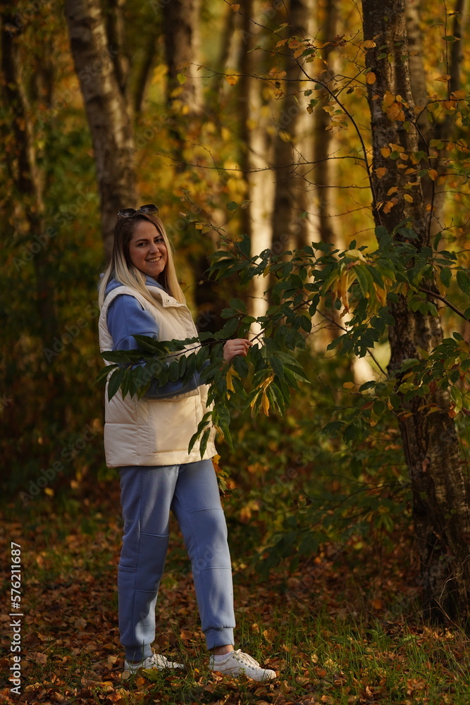 Photo of positive cheerful girl enjoy maple leaves in city center park woods Photo of positive cheerful girl enjoy maple leaves in city center park woods