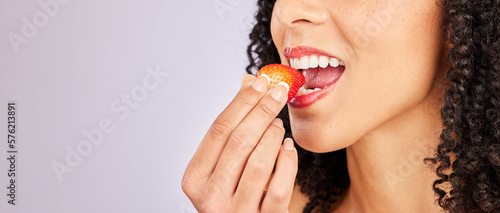 Mockup, strawberry and mouth with a black woman eating in studio on a gray background to promote health. Food, fruit and beauty with a female biting a berry on blank mock up space for a wellness diet