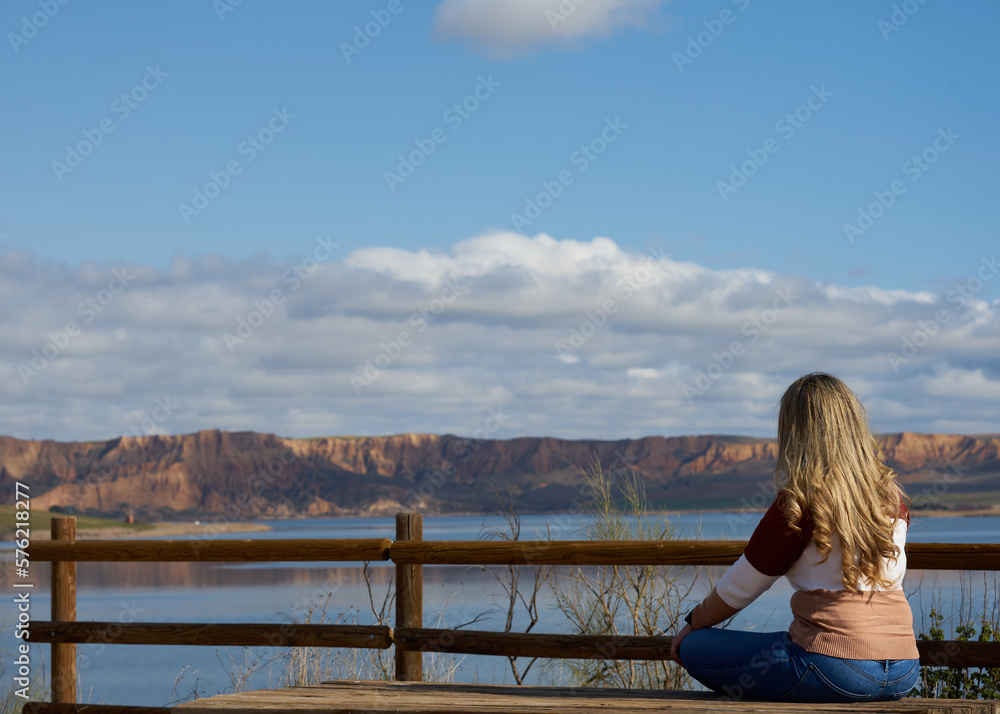 
woman meditating in nature
