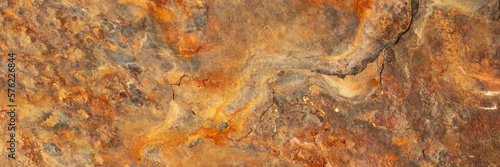 Rust of metals.Corrosive Rust on old iron with a hole. Rusted orange painted metal wall. Rusty metal background with streaks of rust. Old shabby paint.metal rust texture background © Максим Чернышов