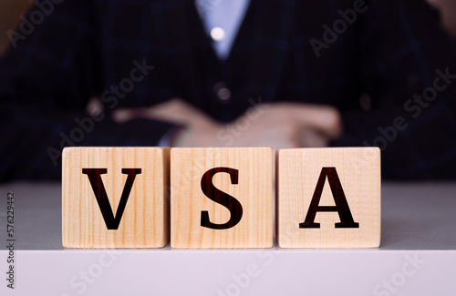 The word VSA written on wood cube. © Uuganbayar