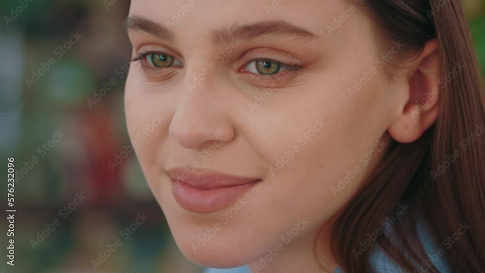 Close up Girl Face with Beautiful Smiling Looking around with Green Eyes. Attractive Young Woman is having Healthy Teeth and Skin. Natural Beauty. Fresh look. Face Mode Close up Girl Face with Beautiful Smiling Looking around with Green Eyes. Attractive Young Woman is having Healthy Teeth and Skin. Natural Beauty. Fresh look. Face Mode