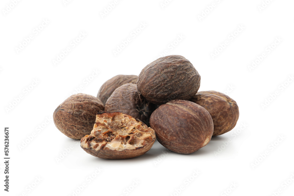 Concept of spices and condiments, nutmegs, isolated on white background Concept of spices and condiments, nutmegs, isolated on white background
