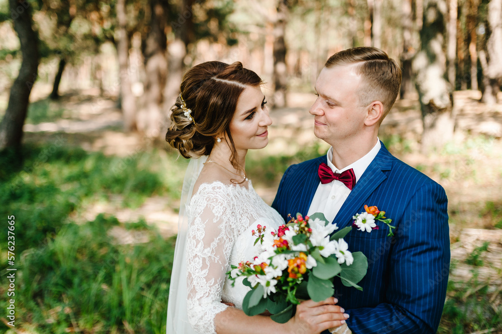 Happy bride and groom looking at each other. Happy bride and groom looking at each other.