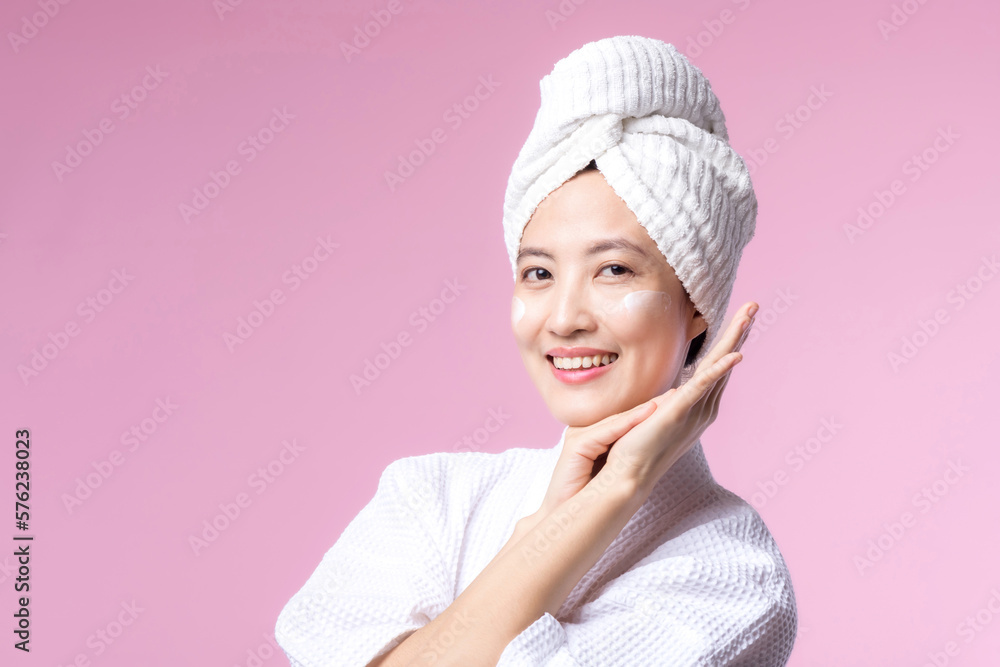 Young asian woman applying facial skincare face cream, cosmetic moisturiser on healthy natural skin make up face. Portrait glowing smile girl person model with care beauty product, spa, cosmetology. Young asian woman applying facial skincare face cream, cosmetic moisturiser on healthy natural skin make up face. Portrait glowing smile girl person model with care beauty product, spa, cosmetology.
