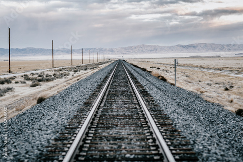 Railroad tracks crossing barren desert, Salt Lake City, Utah, USA