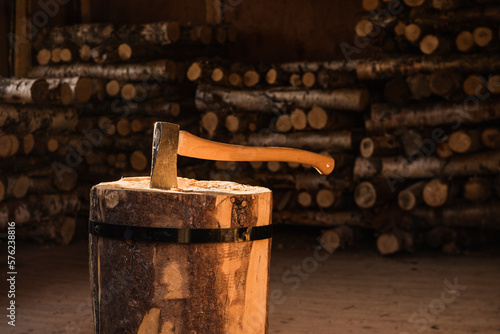 Axe for chopping firewood in woodshed at STF Sitojaure mountain hut, Kungsleden Trail, Lapland, Sweden
