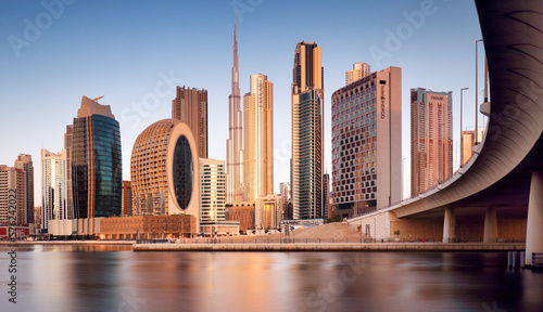 Obraz na plátně Panoramic view of Dubai Creek and sunrise city skyline, United Arab Emirates, ni