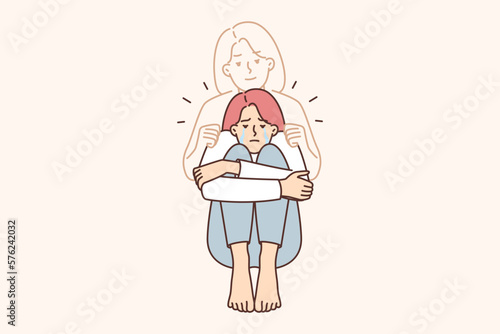 Depressed woman crying over death of mother or sister grieving over loss and loss of relative