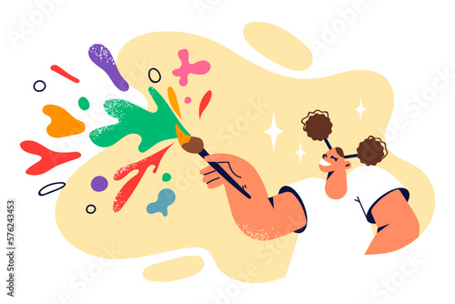 Funny teenage girl who wants to become artist uses brush to paint and creative hobby