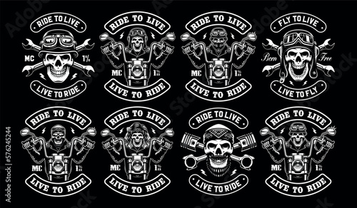 Bundle of vintage motorcycle badges with skull biker on a dark background