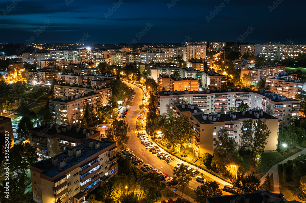 Long exposure of blocks of flats at night with traffic trails and lights - post soviet Krakow cityscape