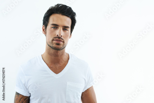 I make this shirt look good. Shot of handsome man wearing a white t-shirt. © Cameron M/peopleimages.com