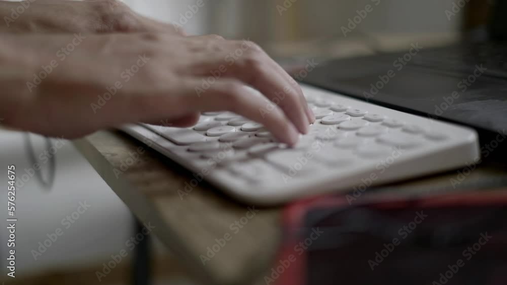 Young man's hands are busy typing on the keyboard Young man's hands are busy typing on the keyboard