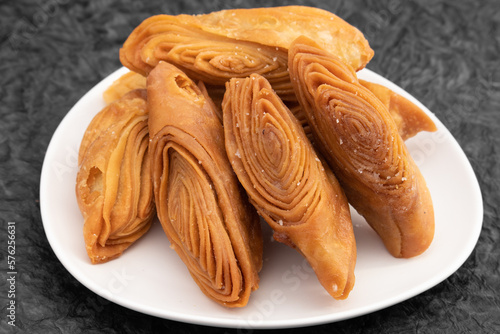 Indian Madatha Thumb Khaja Also Called Gottam Kaja, Badusha, Chirote, Kakinada Kaaja Is Traditional Layered Sweet Puff Pastry Famous In Andhra, Bengal, Gujrat, Bihar, Agra, Odisha, Orrisa In India photo