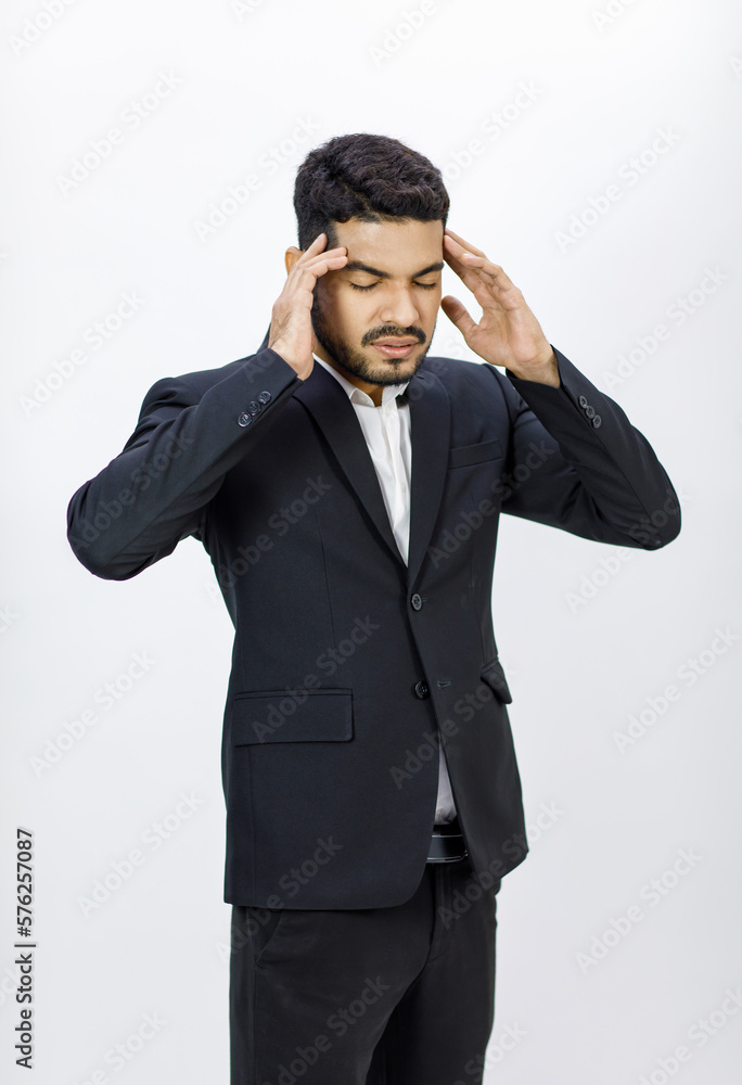 Portrait studio shot Millennial Asian Indian stressed depressed upset professional bearded male businessman in formal business suit holding hands on head having headache shouting on white background Portrait studio shot Millennial Asian Indian stressed depressed upset professional bearded male businessman in formal business suit holding hands on head having headache shouting on white background